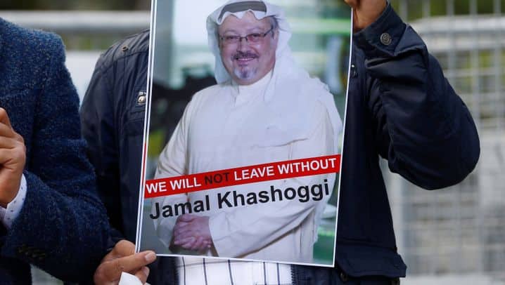 A demonstrator holds picture of Saudi journalist Jamal Khashoggi during a protest in front of Saudi Arabia's consulate in Istanbul